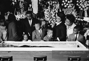 Members of King’s family, including his wife and children, view his body as it lies in state,  Atlanta, Georgia.  1968-


“The King family had had to share him with the world all his life, and now he was finally home. He once voiced how he wished to be remembered and those words resonated at his funeral. ‘I’d like someone to mention that I tried to be right on the war question … that I did try to feed the hungry … that I did try, in my life, to clothe those who were naked … that I did try, in
my life, to visit those who were in prison … that I tried to love and serve humanity.’”