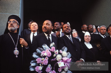 Dr. King carrying a wreath, leads a memorial march for civil-rights crusader, Rev. James Reeb.Selma, Alabama. 1965