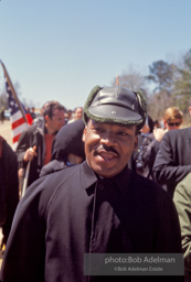 Martin Luther King, wearing a borrowed hat, on the Selma to Montgomery march, Alabama, 1965