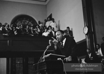 During a mass meeting at the 16th Street Baptist Church, King urges his supporters to join the demonstrations,  Birmingham,  Alabama.  1963