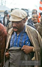 Braving the rain and singing, Martin Luther King leads the Selma to Montgomery march as it approaches it's finale in Montgomery, Alabama. 1965