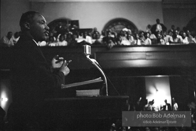 During a mass meeting at the 16th Street Baptist Church, King urges his supporters to join the demonstrations,  Birmingham,  Alabama.  1963