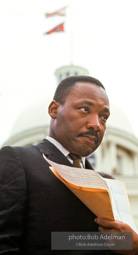 Martin Luther King prepares to speak at Montgomery, Alabama. 1965