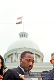 Martin Luther King prepares to speak at Montgomery, Alabama. 1965