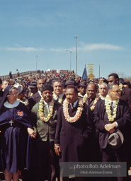 Martin Luther King crossing the Edmund Pettus bridge at the beginning of the Selma to Montgomery march, Selma Alabama, 1965.