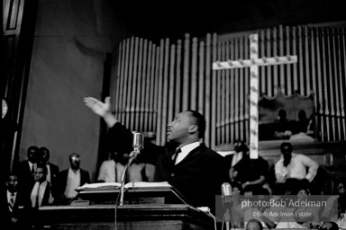 During a mass meeting at the 16th Street Baptist Church, King urges his supporters to join the demonstrations,  Birmingham,  Alabama.  1963