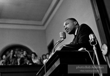 During a mass meeting at the 16th Street Baptist Church, King urges his supporters to join the demonstrations,  Birmingham,  Alabama.  1963