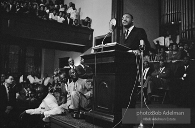 During a mass meeting at the 16th Street Baptist Church, King urges his supporters to join the demonstrations,  Birmingham,  Alabama.  1963