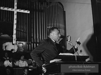 During a mass meeting at the 16th Street Baptist Church, King urges his supporters to join the demonstrations,  Birmingham,  Alabama.  1963