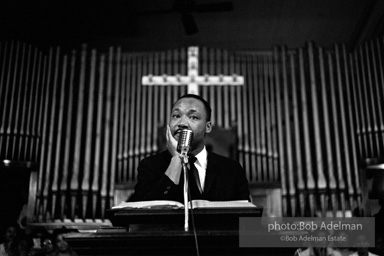 During a mass meeting at the 16th Street Baptist Church, King urges his supporters to join the demonstrations,  Birmingham,  Alabama.  1963