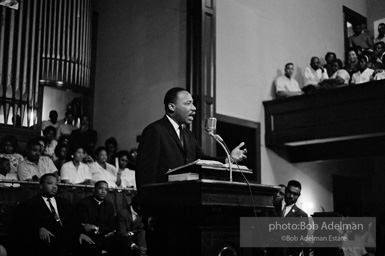 During a mass meeting at the 16th Street Baptist Church, King urges his supporters to join the demonstrations,  Birmingham,  Alabama.  1963