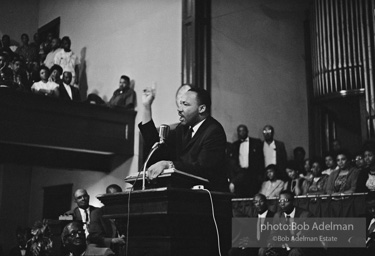 During a mass meeting at the 16th Street Baptist Church, King urges his supporters to join the demonstrations,  Birmingham,  Alabama.  1963