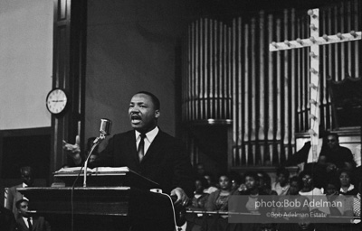 During a mass meeting at the 16th Street Baptist Church, King urges his supporters to join the demonstrations,  Birmingham,  Alabama.  1963