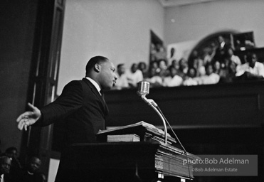 During a mass meeting at the 16th Street Baptist Church, King urges his supporters to join the demonstrations,  Birmingham,  Alabama.  1963