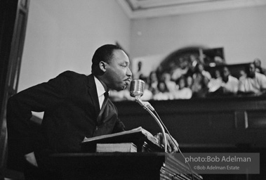 During a mass meeting at the 16th Street Baptist Church, King urges his supporters to join the demonstrations,  Birmingham,  Alabama.  1963