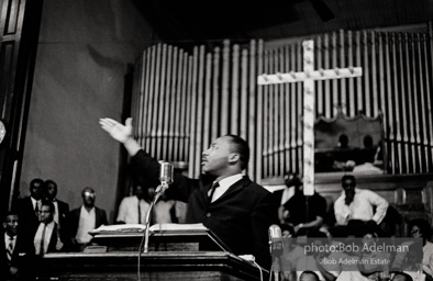 During a mass meeting at the 16th Street Baptist Church, King urges his supporters to join the demonstrations,  Birmingham,  Alabama.  1963