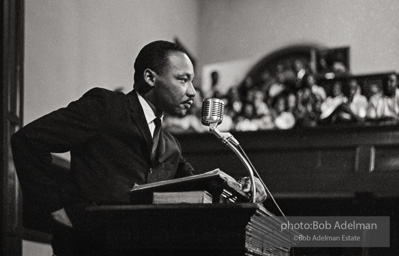 During a mass meeting at the 16th Street Baptist Church, King urges his supporters to join the demonstrations,  Birmingham,  Alabama.  1963