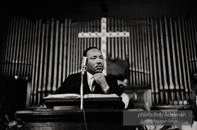 During a mass meeting at the 16th Street Baptist Church, King urges his supporters to join the demonstrations,  Birmingham,  Alabama.  1963