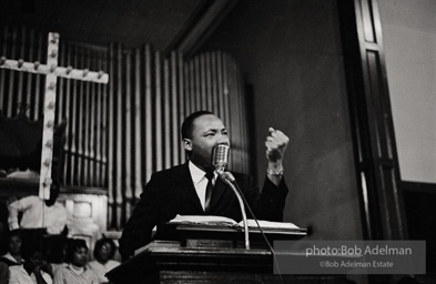 During a mass meeting at the 16th Street Baptist Church, King urges his supporters to join the demonstrations,  Birmingham,  Alabama.  1963