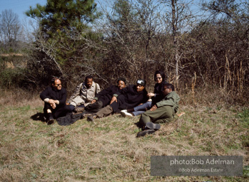 Martin Luther King and his aides stop for a rest on the Selma to Montgomery march(from R to L bernard Lee, Coretta King, MLK, Rev Abernathy, John Lewis, and an unidentifiedpriest.. Alabama, 1965.