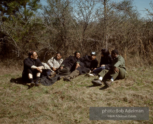 Martin Luther King and his aides stop for a rest on the Selma to Montgomery march(from R to L bernard Lee, Coretta King, MLK, Rev Abernathy, John Lewis, and an unidentifiedpriest.. Alabama, 1965.