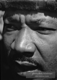 Martin Luther King, wearing a borrowed hat, on the Selma to Montgomery march, Alabama, 1965