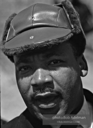 Martin Luther King, wearing a borrowed hat, on the Selma to Montgomery march, Alabama, 1965