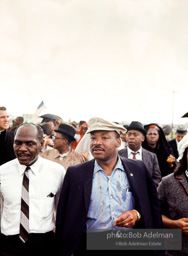 Braving the rain, Martin Luther King leads the Selma to Montgomery march as it approaches it's finale in Montgomery, Alabama. 1965