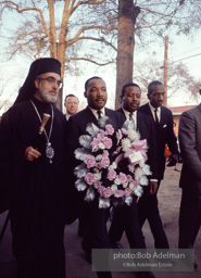 Dr. Kingcarrying a wreath, leads a memorial march for civil-rights crusader, Rev. James Reeb.Selma, Alabama. 1965