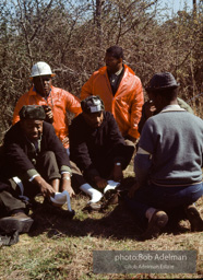 A a resting point during the Selma to Montgomery march, Dr. King changes socks. Alabama. 1965