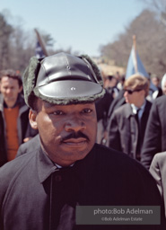 Martin Luther King, wearing a borrowed hat, on the Selma to Montgomery march, Alabama, 1965