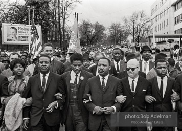 Dr. King leads a protest march around the state capital in Montgomery Alabama protesting the treatment of black demonstrators and voter applicants in Selma, Alabama prior to the Selma to Montgomery march. Montgomery, Alabama. 1965.