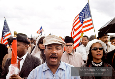 Glory bound: King and his wife, Coretta, lead the marchers on Jefferson Davis Highway en route to Montgomery,  Alabama.  1965