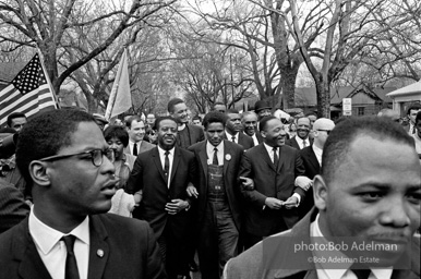 Dr. King leads a protest march around the state capital in Montgomery Alabama protesting the treatment of black demonstrators and voter applicants in Selma, Alabama prior to the Selma to Montgomery march. Montgomery, Alabama. 1965.