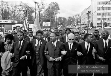 Dr. King leads a protest march around the state capital in Montgomery Alabama protesting the treatment of black demonstrators and voter applicants in Selma, Alabama prior to the Selma to Montgomery march. Montgomery, Alabama. 1965.