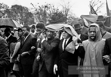 Dr. King leads a protest march around the state capital in Montgomery Alabama protesting the treatment of black demonstrators and voter applicants in Selma, Alabama prior to the Selma to Montgomery march. Montgomery, Alabama. 1965.