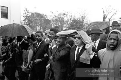 Dr. King leads a protest march around the state capital in Montgomery Alabama protesting the treatment of black demonstrators and voter applicants in Selma, Alabama prior to the Selma to Montgomery march. Montgomery, Alabama. 1965.