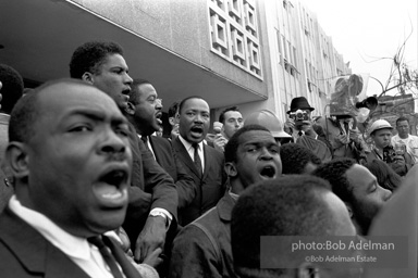 Demonstrators conclude  in front of court house with the singing of 