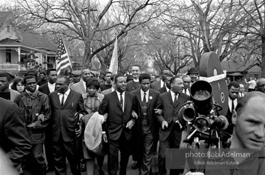 Dr. King leads a protest march around the state capital in Montgomery Alabama protesting the treatment of black demonstrators and voter applicants in Selma, Alabama prior to the Selma to Montgomery march. Montgomery, Alabama. 1965.