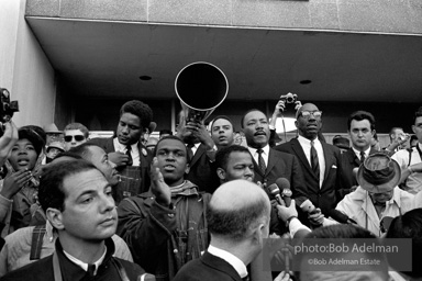 Rev. Abernathy speaking in front of Selma city hall protesting the denial of the right to vote to black citizens of Selma, Alabama. 1965