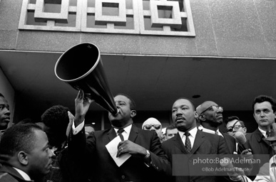 Rev. Abernathy speaking in front of Selma city hall protesting the denial of the right to vote to black citizens of Selma, Alabama. 1965