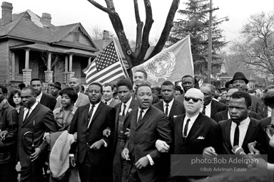 Dr. King leads a protest march around the state capital in Montgomery Alabama protesting the treatment of black demonstrators and voter applicants in Selma, Alabama prior to the Selma to Montgomery march. Montgomery, Alabama. 1965.