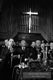 King leads the singing of “We Shall Overcome” after eulogizing a slain civil rights crusader, the Reverend James Reeb, Brown Chapel,  Selma,  Alabama.  1965