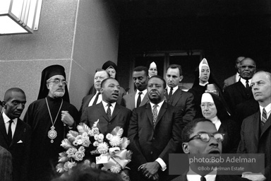 Dr. King carrying a wreath, leads a memorial march for civil-rights crusader, Rev. James Reeb.Selma, Alabama. 1965