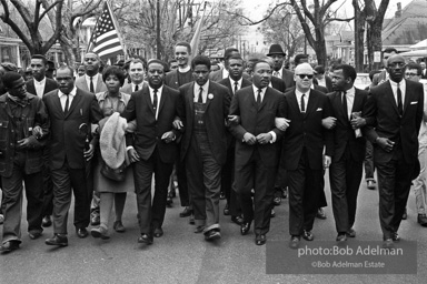 Dr. King leads a protest march around the state capital in Montgomery Alabama protesting the treatment of black demonstrators and voter applicants in Selma, Alabama prior to the Selma to Montgomery march. Montgomery, Alabama. 1965.