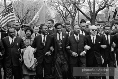 Dr. King leads a protest march around the state capital in Montgomery Alabama protesting the treatment of black demonstrators and voter applicants in Selma, Alabama prior to the Selma to Montgomery march. Montgomery, Alabama. 1965.