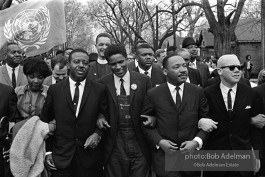 Dr. King leads a protest march around the state capital in Montgomery Alabama protesting the treatment of black demonstrators and voter applicants in Selma, Alabama prior to the Selma to Montgomery march. Montgomery, Alabama. 1965.