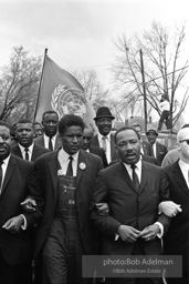 Dr. King leads a protest march around the state capital in Montgomery Alabama protesting the treatment of black demonstrators and voter applicants in Selma, Alabama prior to the Selma to Montgomery march. Montgomery, Alabama. 1965.