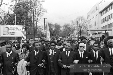 Dr. King leads a protest march around the state capital in Montgomery Alabama protesting the treatment of black demonstrators and voter applicants in Selma, Alabama prior to the Selma to Montgomery march. Montgomery, Alabama. 1965.