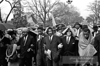 Dr. King leads a protest march around the state capital in Montgomery Alabama protesting the treatment of black demonstrators and voter applicants in Selma, Alabama prior to the Selma to Montgomery march. Montgomery, Alabama. 1965.